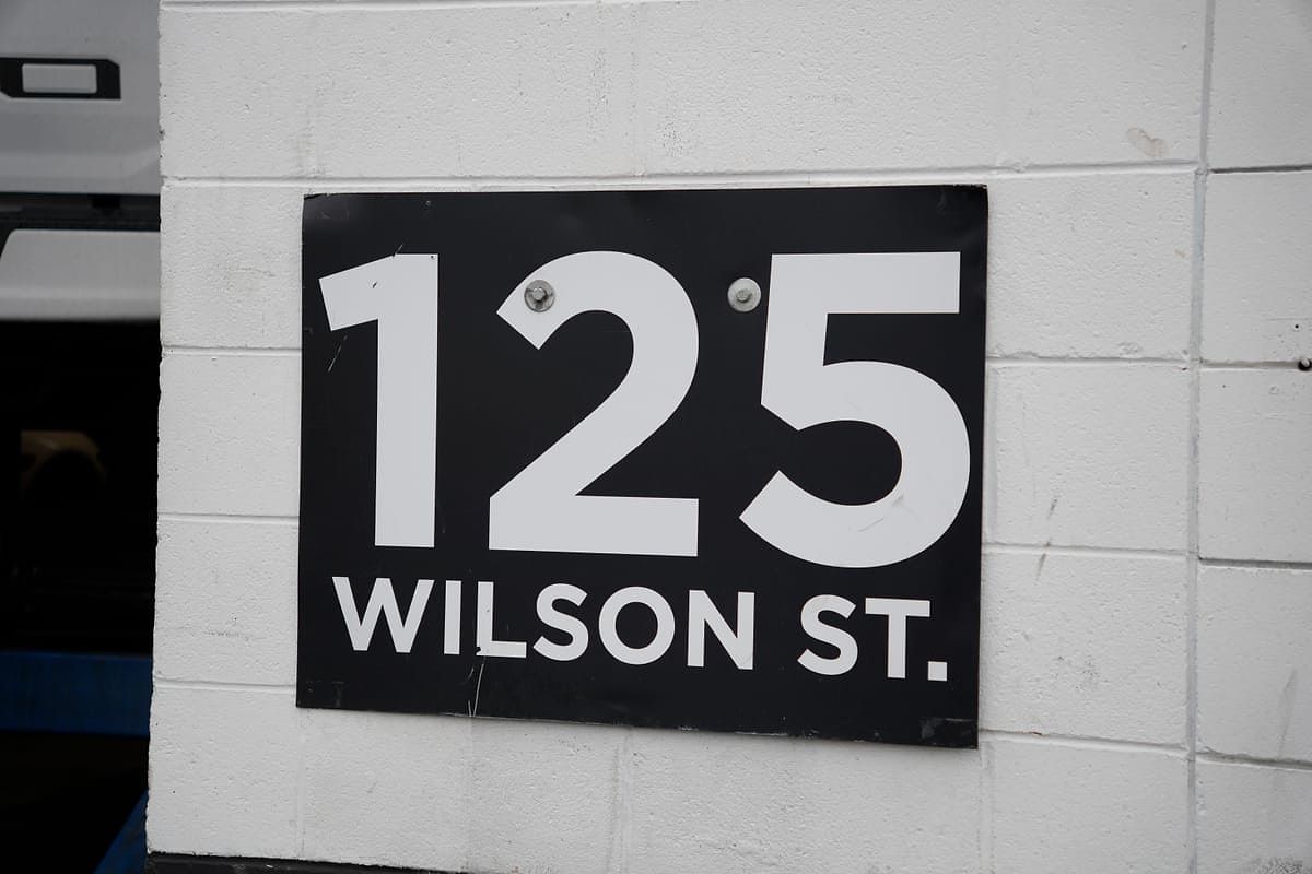 The 125 Wilson St. address sign on the LSG Auto Nation building