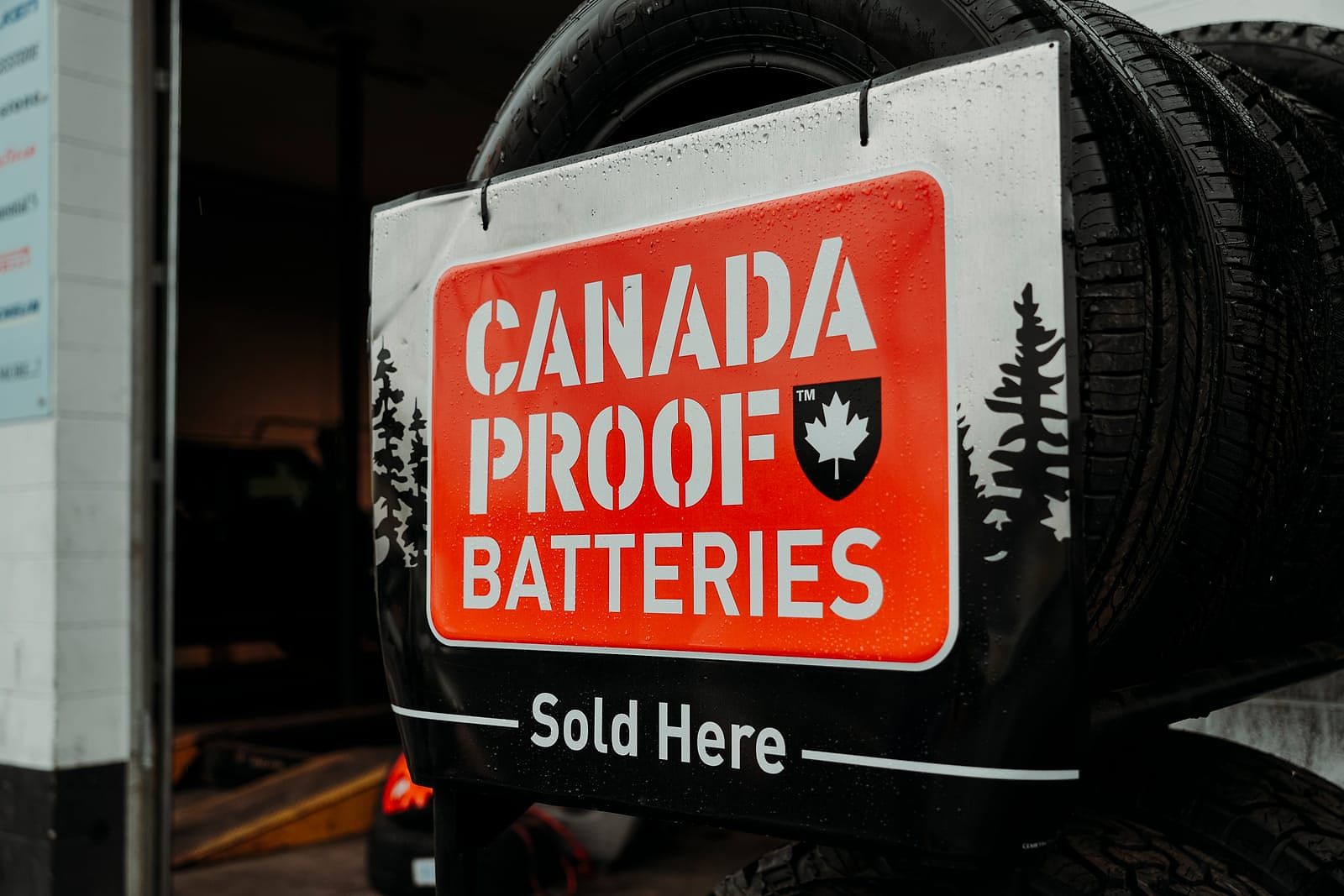 Canada Proof Batteries sold here sign at LSG Auto Nation