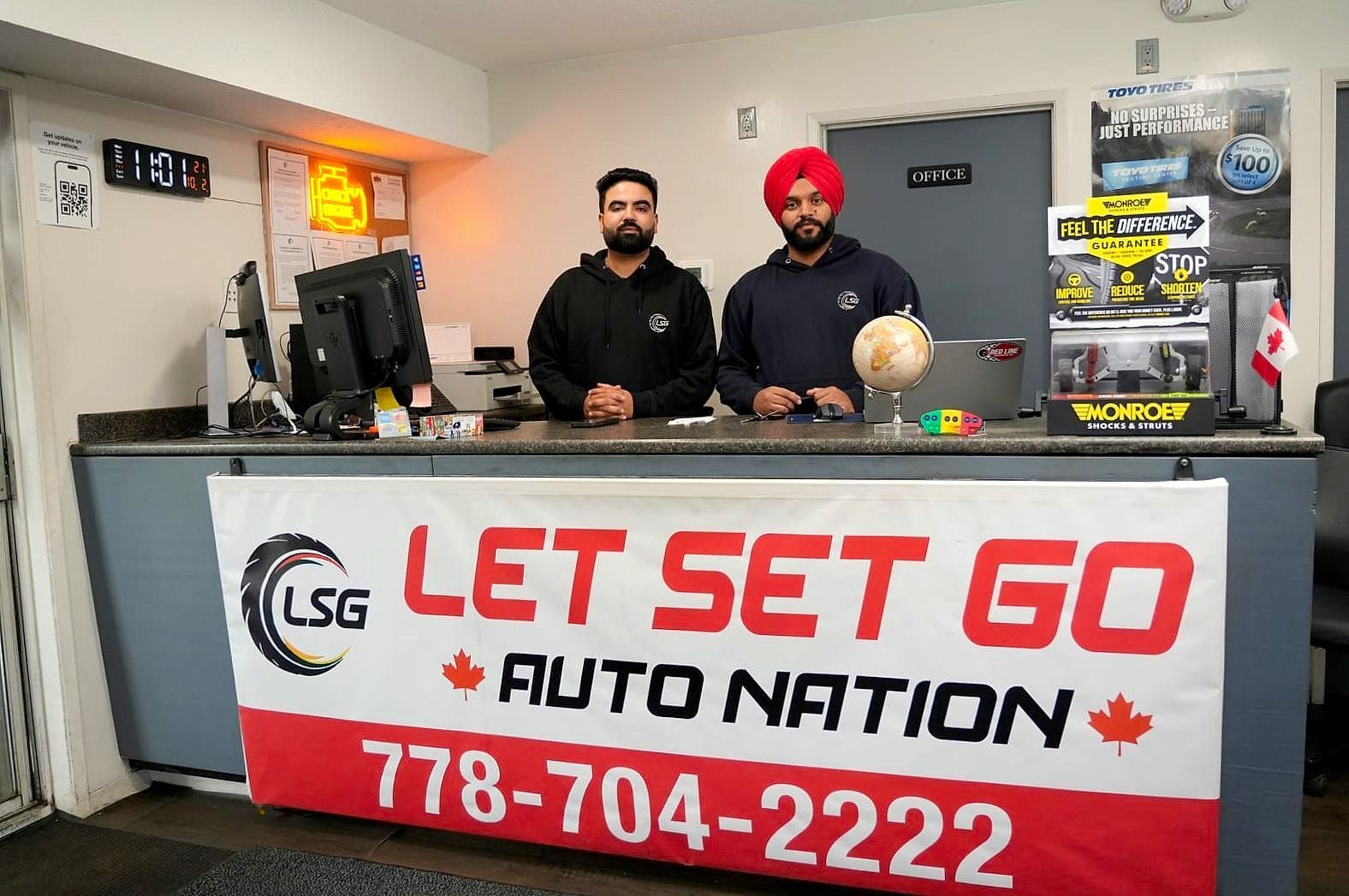 Two LSG Auto Nation staff at the front counter