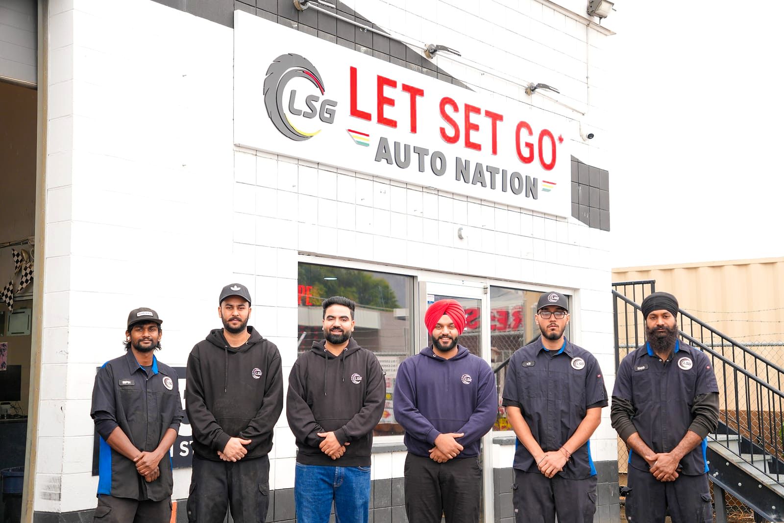 The LSG Auto Nation team outside the shop